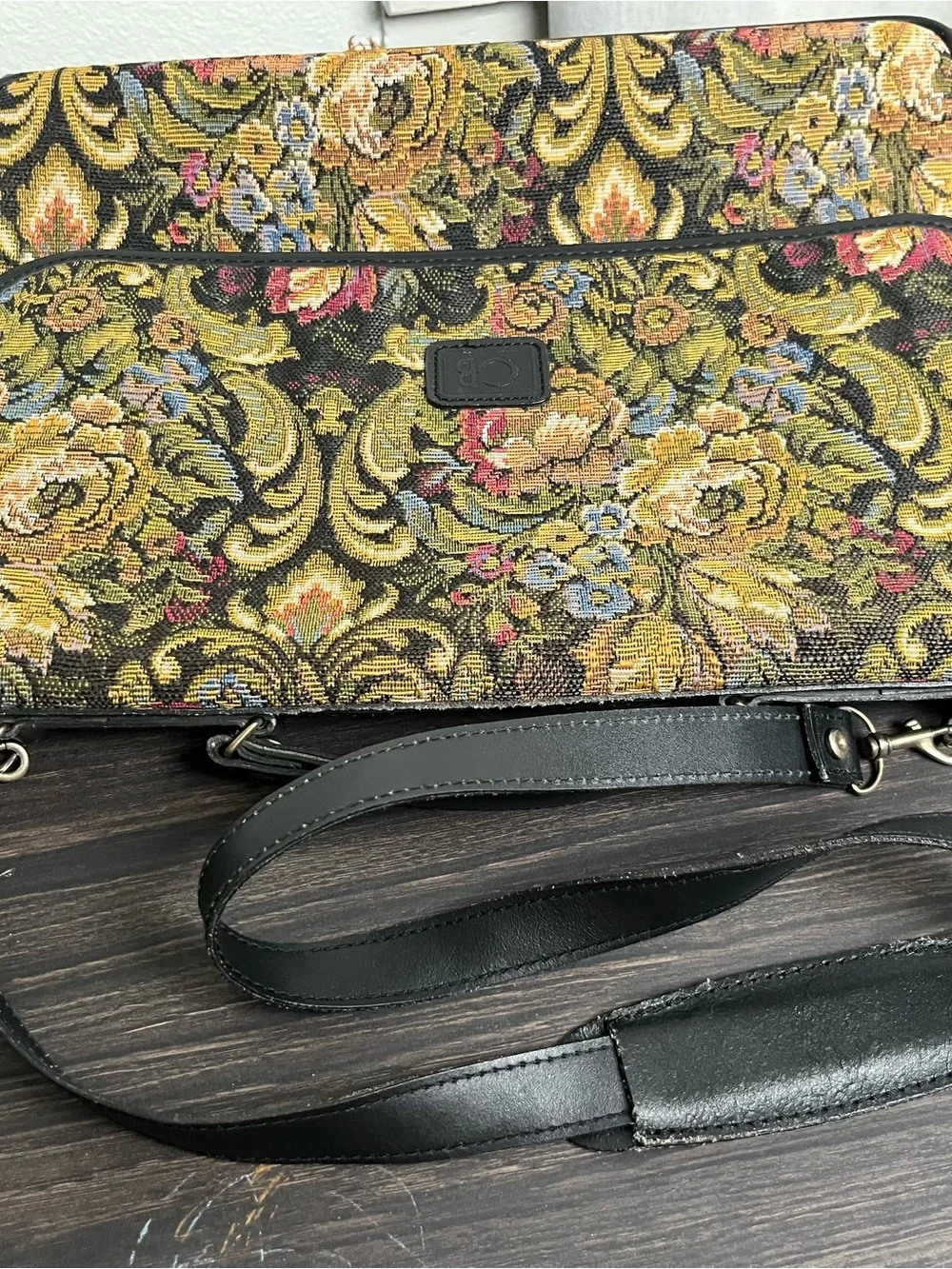 Geoffrey Beene messenger bag ft vibrant floral tapestry ext & black leather trim